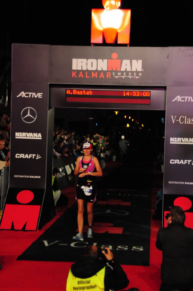 Anna Bastek crossing the finish line of the Ironman