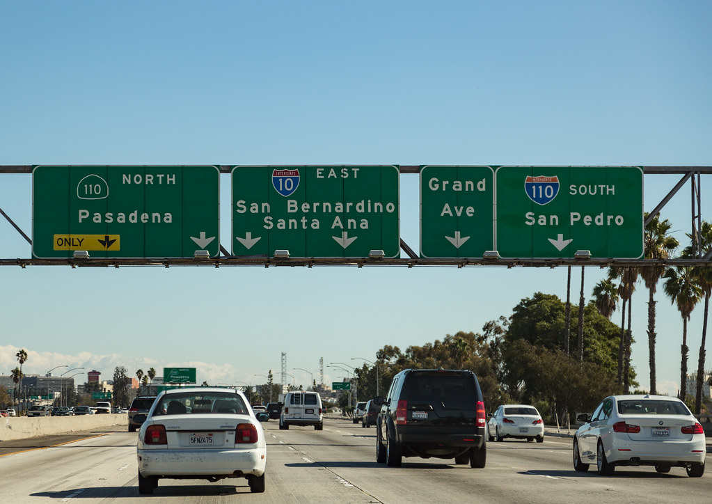 Road signs on a US highway for cities with Spanish names