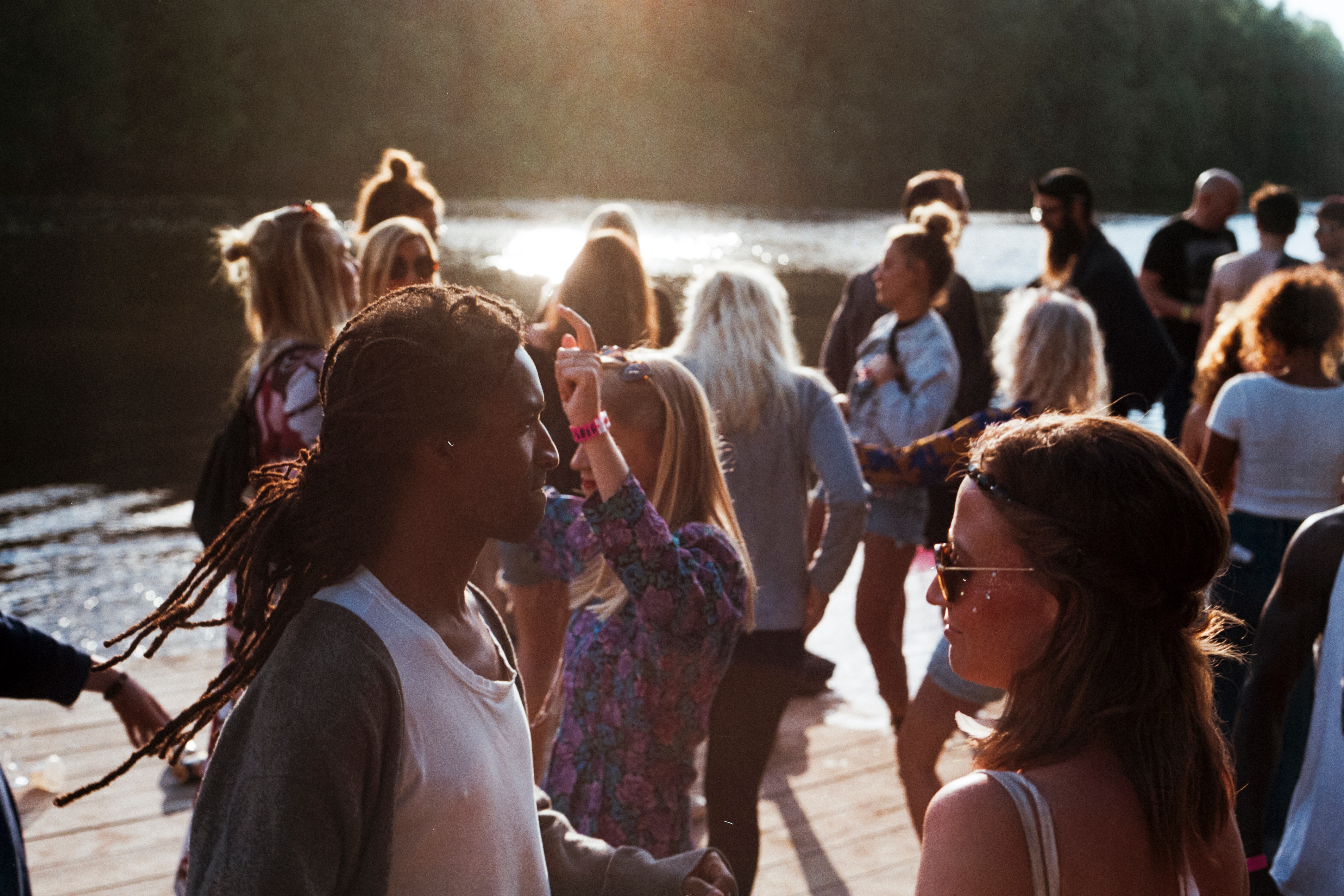 International youth gather beside a lake